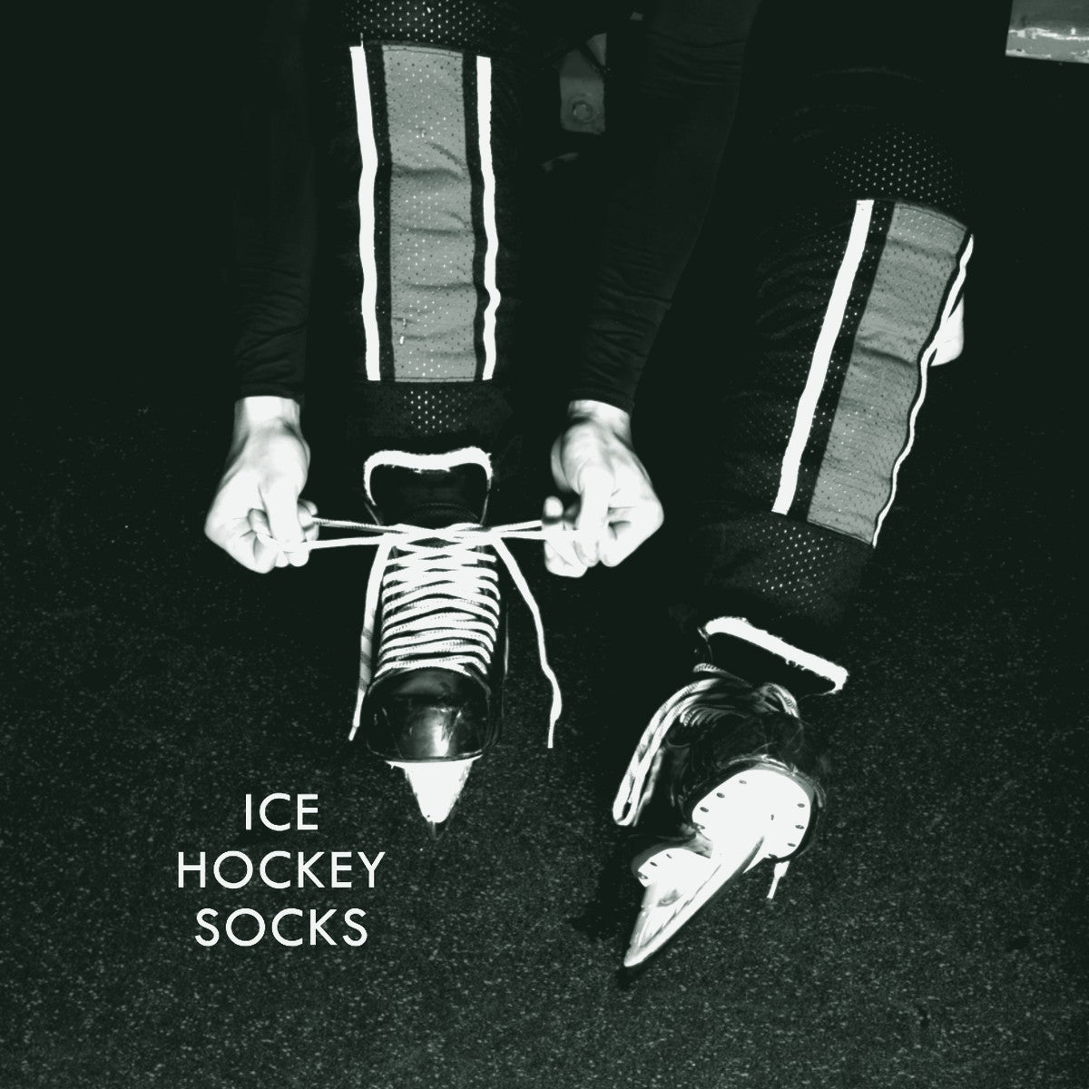 Green and black ice hockey socks over shin guards, ThreaderPros custom ice hockey socks