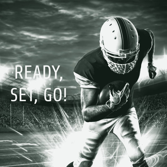 Football player in red uniform running with the ball under stadium lights, promoting ThreaderPros custom football uniform sets