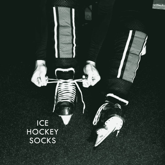 Green and black ice hockey socks over shin guards, ThreaderPros custom ice hockey socks