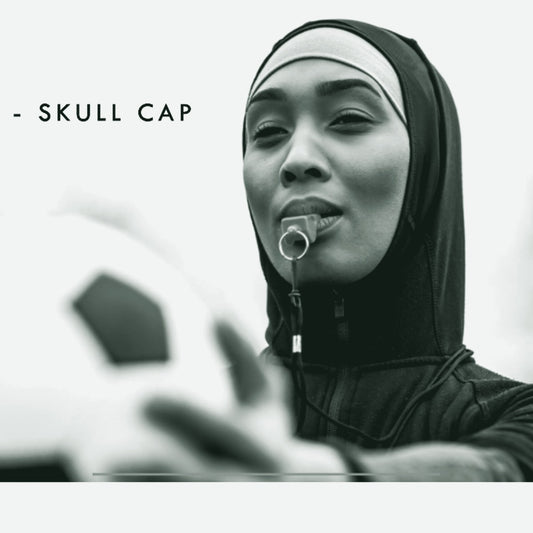 Athlete wearing a black skull cap holding a soccer ball, ThreaderPros custom skull cap