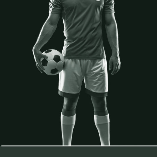 A male model wearing a green and white soccer jersey with a soccer ball on the left chest area. The model has a confident pose and is ready to play. ThreaderPros men's custom soccer jersey.