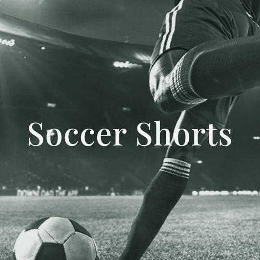 Soccer player in blue kit dribbling a ball, ThreaderPros men's custom soccer shorts